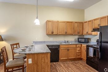 Fully Equipped Kitchen With Modern Appliances at The Gardens at Jackson Creek, Independence, 64057
